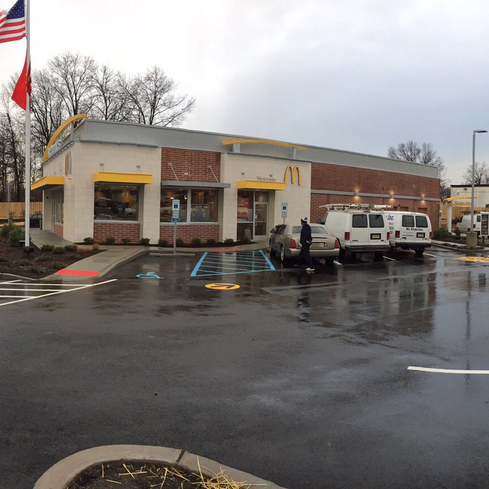 McDonald's - a parking lot with cars parked in front of it - Fast Food Near Me - Roselle Park, New Jersey
