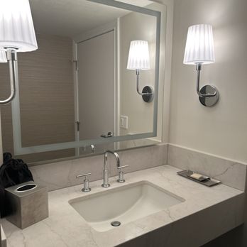 Hotel Metropole - Bathroom mirror with warm and cool lighting options. Came with complimentary hand soap, shampoo, conditioner, body wash,shower cap. - Hotels Near Me - Avalon, California