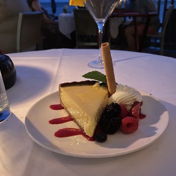 Louie's Backyard - Key Lime Pie with Whipped Cream and Berries - New American Near Me - Key West, Florida Louie's Backyard - Key Lime Pie with Whipped Cream and Berries - New American Near Me - Key West, Florida