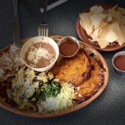 Custom entree with quesabirria tacos (2) and a beef enchilada (1). 2 sides = calabacitas and refried beans. $17.95 (1/2025) Custom entree with quesabirria tacos (2) and a beef enchilada (1). 2 sides = calabacitas and refried beans. $17.95 (1/2025)