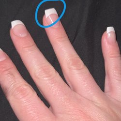 Les Nails - Filed off part of the artificial nail under the acrylic that he did.