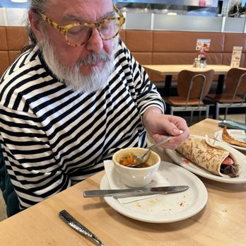 Olga's Kitchen - Local celebrity Elite Yelper Jeffrey Rodriguez enjoying a cup of peasant soup and an original Olga. - Salad Near Me - Monroe, Michigan