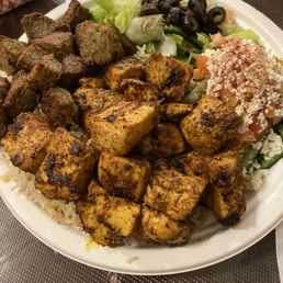 Lamb-beef, chicken over basmati rice. Incl cucumber and house salad Lamb-beef, chicken over basmati rice. Incl cucumber and house salad