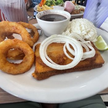Habanos Oceanfront - Uruguay steak, onion rings, black beans and rice - Cuban Near Me - Islamorada, Florida Habanos Oceanfront - Uruguay steak, onion rings, black beans and rice - Cuban Near Me - Islamorada, Florida