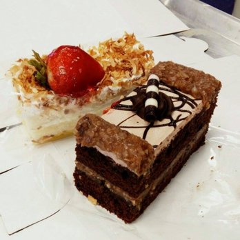 Mirabelle Cafe - The strawberry one is light with toasted coconut on top. Next to it is the German chocolate slice ^^ - Desserts Near Me - Fair Oaks, California Mirabelle Cafe - The strawberry one is light with toasted coconut on top. Next to it is the German chocolate slice ^^ - Desserts Near Me - Fair Oaks, California