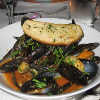 Swing 46 - Prince Edward Island Mussels with White Wine, Garlic and Herb Seafood Broth served with a Garlic Crostini - New American Near Me - New York, New York Swing 46 - Prince Edward Island Mussels with White Wine, Garlic and Herb Seafood Broth served with a Garlic Crostini - New American Near Me - New York, New York