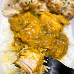 Tandoor - Chicken Curry over white rice, big chunks of juicy boneless chicken
