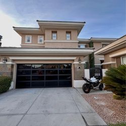 Hearth & Home Specialties - Full view garage door: 16'0 X 7'0 EL100. Dark bronze anodized. 1/4" black laminate glass.