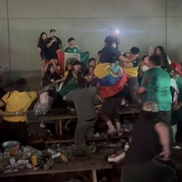 People fighting on tables before throwing glass bottles and cans and metal buckets for ice.