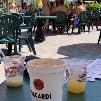 Coconuts Beachfront Restaurant Bar & Grill - Bacardi island punch rum bucket, frozen pina on left and orange crush on right! - Bars Near Me - Ocean City, Maryland Coconuts Beachfront Restaurant Bar & Grill - Bacardi island punch rum bucket, frozen pina on left and orange crush on right! - Bars Near Me - Ocean City, Maryland