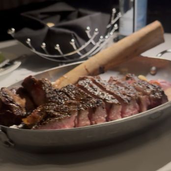 The Pines Modern Steakhouse - Perfection of a Tomahawk Aged Ribeye Steak - Steakhouses Near Me - S Highland, California The Pines Modern Steakhouse - Perfection of a Tomahawk Aged Ribeye Steak - Steakhouses Near Me - S Highland, California