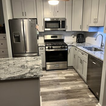 O&S Laborers - a kitchen with stainless steel appliances - General Contractors Near Me O&S Laborers - a kitchen with stainless steel appliances - General Contractors Near Me