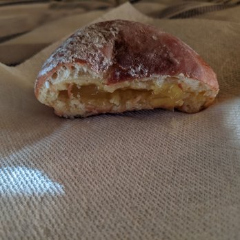 Johnny's Donuts - Lemon jelly filled donut, half eaten - Donuts Near Me - Lafayette, California Johnny's Donuts - Lemon jelly filled donut, half eaten - Donuts Near Me - Lafayette, California