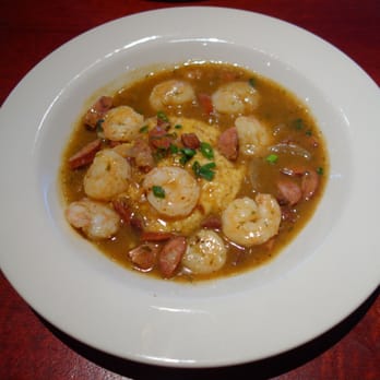 Lucky 32 Southern Kitchen - Shrimp & Grits - wild-caught American shrimp, andouille sausage, onions and Tasso ham gravy over Old Mill of Guilford grits - New American Near Me - Cary, North Carolina Lucky 32 Southern Kitchen - Shrimp & Grits - wild-caught American shrimp, andouille sausage, onions and Tasso ham gravy over Old Mill of Guilford grits - New American Near Me - Cary, North Carolina