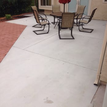 San Diego Reconstruction Specialist - a patio with chairs and an umbrella - General Contractors Near Me San Diego Reconstruction Specialist - a patio with chairs and an umbrella - General Contractors Near Me