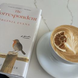 Reading a book and enjoying a jaffa latte. Reading a book and enjoying a jaffa latte.