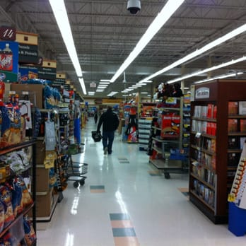 Kroger - a man walking down the aisle of a grocery store - Grocery Near Me - Brownstown Township, Michigan