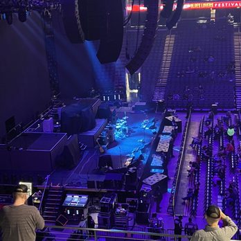 BJCC - a man taking a picture of a concert - Performing Arts Near Me - Birmingham, Alabama