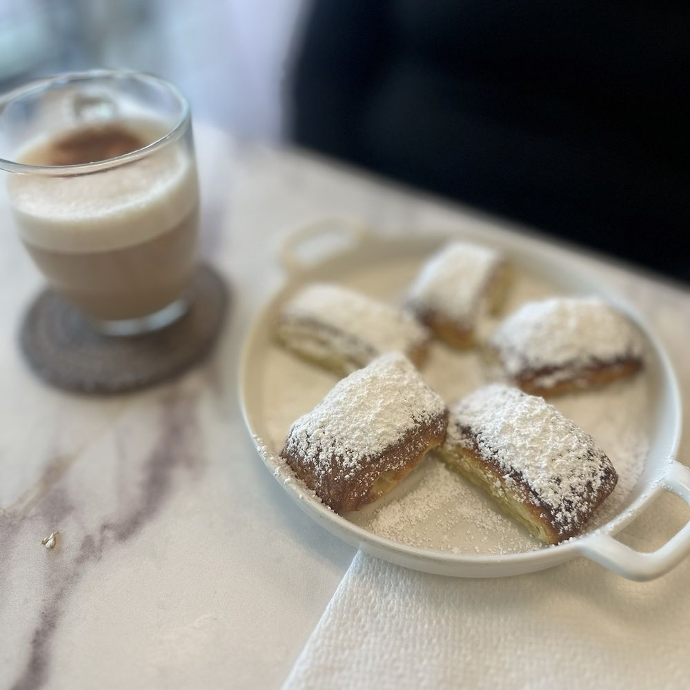 Cafe Flore - tasty little beignets and cappuccino with almond milk - Breakfast & Brunch Near Me - Fort Myers, Florida