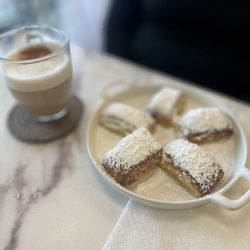Cafe Flore - Tasty little beignets and cappuccino with almond milk