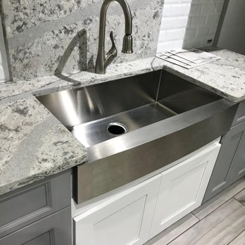 AAA Kitchen and Bath US - Stainless steel farm sink installed in white shaker cabinet along with luxury Cambria quartz. - General Contractors Near Me - Columbia, Maryland