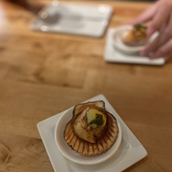 KAI ZAN - a scallop on a plate with chopsticks - Asian Fusion Near Me - Chicago, Illinois