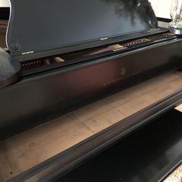 Empty piano board awaiting return of keyboard taken by Brandon Lewis.