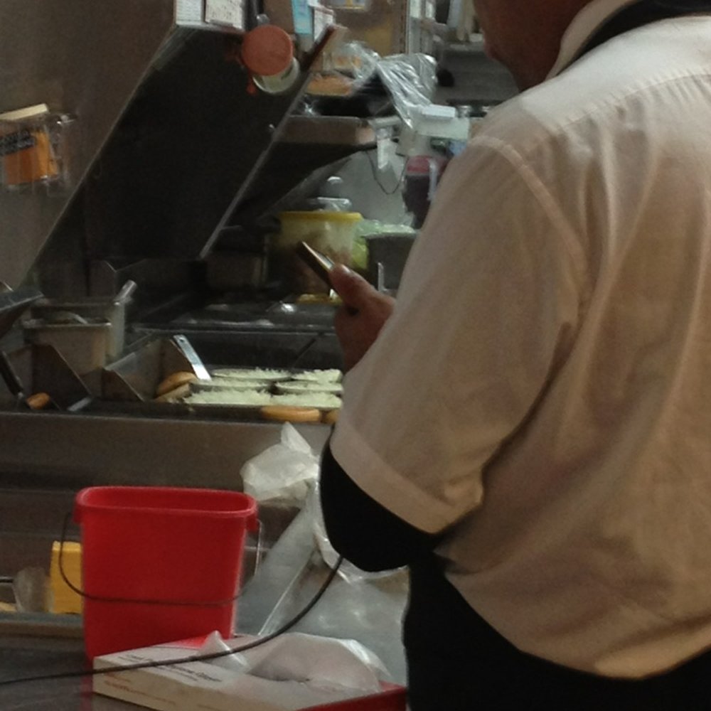 Steak ’n Shake - This kitchen person was more concerned about his phone than taking care of orders. - Fast Food Near Me - Columbus, Ohio