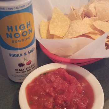 Las Caras - Chips and salsa with hard seltzer while waiting for my family to arrive. - Mexican Near Me - Denver, Colorado Las Caras - Chips and salsa with hard seltzer while waiting for my family to arrive. - Mexican Near Me - Denver, Colorado