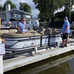 Pontoon boat and crew.