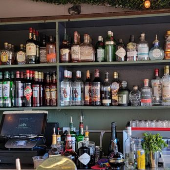 Terrasse Place d'Armes - a bar with bottles of alcohol - Bars Near Me - Montreal, Quebec Terrasse Place d'Armes - a bar with bottles of alcohol - Bars Near Me - Montreal, Quebec