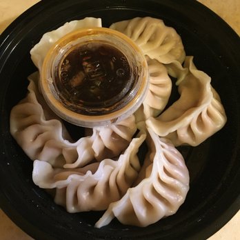 Hut Wok - a plate of dumplings and sauce - Chinese Near Me - Prairieville, Louisiana