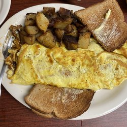 Kozy Corner Cafe - Chili cheese omelette with home fries and toast!