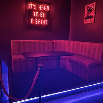 Old 86 - a booth with a neon sign - Bars Near Me - Cleveland, Ohio