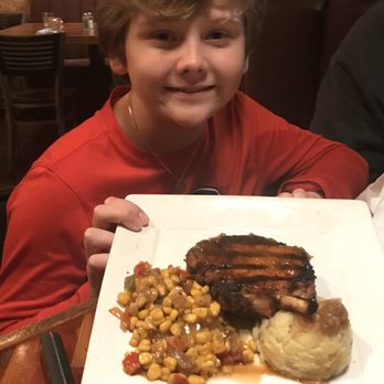 The Place - Glazed pork chop with mashed potatoes and creole corn - Southern Near Me - Athens, Georgia
