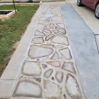 Morales Lawn Service - a driveway with a stone path - Landscaping Near Me Morales Lawn Service - a driveway with a stone path - Landscaping Near Me