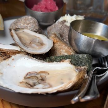 Alta Bistro - a plate of oysters on a wooden table - French Near Me - Whistler, British Columbia Alta Bistro - a plate of oysters on a wooden table - French Near Me - Whistler, British Columbia