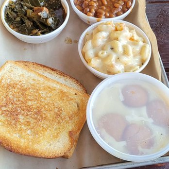 The Pig & Pint - Collard greens, baked beans, smoked Mac and cheese and bananas foster pudding with two pieces of toasted bread. - Barbeque Near Me - Jackson, Mississippi The Pig & Pint - Collard greens, baked beans, smoked Mac and cheese and bananas foster pudding with two pieces of toasted bread. - Barbeque Near Me - Jackson, Mississippi