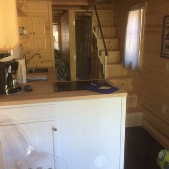 Thousand Trails Leavenworth - Kitchenette on the left, stairs to the loft on the right in the Adeline tiny house. - Campgrounds Near Me - Leavenworth, Washington Thousand Trails Leavenworth - Kitchenette on the left, stairs to the loft on the right in the Adeline tiny house. - Campgrounds Near Me - Leavenworth, Washington