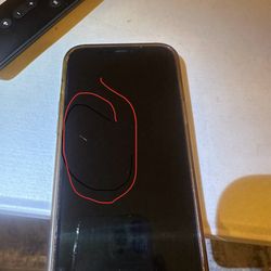 iPhone Wizards - Crack in red circle. Removed screen protector to see crack. Cheap china screen protector