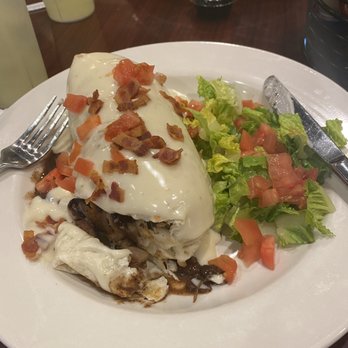 Mountain Harbour Golf Club - Today's special was a pork burrito with grilled onions, dirty rice and a cheese sauce. So good! - Golf Near Me - Hayesville, North Carolina Mountain Harbour Golf Club - Today's special was a pork burrito with grilled onions, dirty rice and a cheese sauce. So good! - Golf Near Me - Hayesville, North Carolina