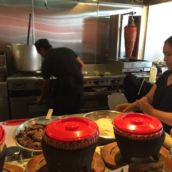 Taco Bar - she mashes the masa to make the tortillas - Mexican Near Me - San Marcos, California Taco Bar - she mashes the masa to make the tortillas - Mexican Near Me - San Marcos, California