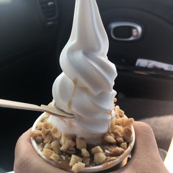 Niu Soft Serve - Hot Kūlolo - Kūlolo sauce with toasted macadamia nuts on niu (plain) coconut-based soft-serve. 'Ono-licious! - Desserts Near Me - Honolulu, Hawaii