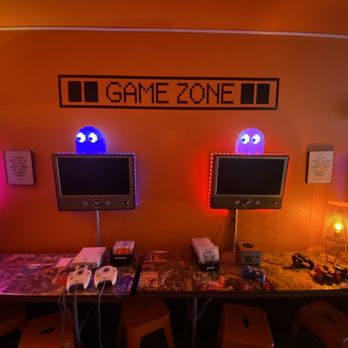 Domestique Satellite - a gaming room with three monitors and a keyboard - Coffee & Tea Near Me - Birmingham, Alabama