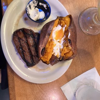 Texas Roadhouse - Weekday Special: $11.99 6oz sirloin Sweet Potato & butter on the side, also had a house salad as my second side. - Steakhouses Near Me - Hollywood Park, Texas