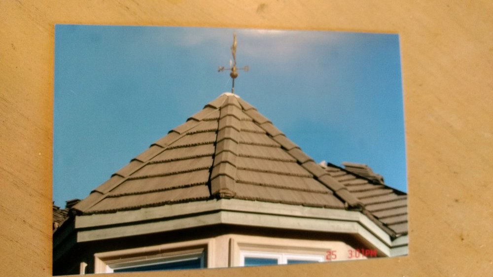 Slide of Magic Hands Roofing