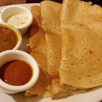 Maveli - Thattu Dosa. A set of three rice and lentil based pancakes served with coconut chutney, tomato chutney and sambhar. - Indian Near Me - Sheffield, XSY