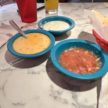 Chuy's - Yummy sauces ( yellow = queso, white = Creamy Jalapeño, salsa) - Mexican Near Me - Houston, Texas Chuy's - Yummy sauces ( yellow = queso, white = Creamy Jalapeño, salsa) - Mexican Near Me - Houston, Texas