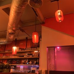 GoBistro - The sake wall of bottles and cool lighting