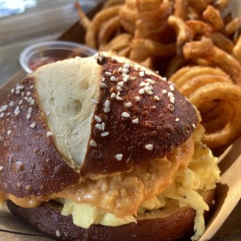Lefty's Day and Night - Egg and Pimento Cheese Pretzel Sammi (brunch special) with Curly Fries! - Bars Near Me - Austin, Texas Lefty's Day and Night - Egg and Pimento Cheese Pretzel Sammi (brunch special) with Curly Fries! - Bars Near Me - Austin, Texas
